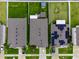Aerial view of homes with well-manicured lawns, backyard features, and solar panels at 12635 Tannencrest Dr, Riverview, FL 33579