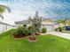 Inviting single-Gathering home boasts a beautifully landscaped front yard, enhancing its curb appeal at 12635 Tannencrest Dr, Riverview, FL 33579