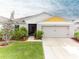 Charming single-Gathering home with well-manicured lawn, complemented by a two-car garage and inviting front entrance at 12635 Tannencrest Dr, Riverview, FL 33579