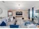 Comfortable living room with modern furnishings, a rustic accent wall, and a cozy atmosphere at 12635 Tannencrest Dr, Riverview, FL 33579