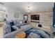 Spacious living room features a comfortable sectional sofa and stylish decor at 12635 Tannencrest Dr, Riverview, FL 33579