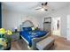 Cozy main bedroom with a decorative bed, bench, and en-suite bathroom access at 12635 Tannencrest Dr, Riverview, FL 33579