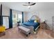 Serene main bedroom with a tufted headboard, bench, and coordinating nightstands at 12635 Tannencrest Dr, Riverview, FL 33579