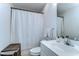 Functional bathroom with a shower/tub, white shower curtain, and vanity sink at 133 S Sherrill St # 133, Tampa, FL 33609