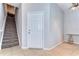 Welcoming entryway with tiled floor, staircase, and closet space, leading into a well-lit interior at 133 S Sherrill St # 133, Tampa, FL 33609