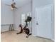Bright entryway featuring tiled floors, shuttered windows, and neutral decor, complemented by a ceiling fan at 133 S Sherrill St # 133, Tampa, FL 33609