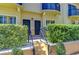 Attractive townhome exterior with manicured landscaping, individual entryways, and stairs at 133 S Sherrill St # 133, Tampa, FL 33609