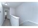 Bright hallway with neutral tones and view of a room with white-shuttered windows at 133 S Sherrill St # 133, Tampa, FL 33609