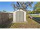 Storage shed in backyard, offering ample space for tools and equipment at 15317 16Th St, Dade City, FL 33523