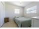 Bright bedroom with neutral walls, large window, and comfortable full-sized bed at 1740 Grove Dr, Clearwater, FL 33759