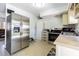 Functional kitchen featuring stainless steel refrigerator and other appliances at 1740 Grove Dr, Clearwater, FL 33759
