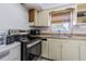 Functional kitchen features modern appliances, ample counter space, and a window for natural light at 1740 Grove Dr, Clearwater, FL 33759