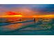 Beautiful sunset on the beach with vibrant colors and calm water, ideal for relaxation at 19451 Gulf Blvd # 301, Indian Shores, FL 33785