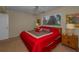 Cozy bedroom featuring a large window and comfortable carpet flooring at 19451 Gulf Blvd # 301, Indian Shores, FL 33785