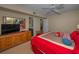 Bedroom featuring a dresser and access to the bathroom at 19451 Gulf Blvd # 301, Indian Shores, FL 33785
