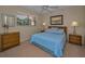 Bedroom featuring a large bed and comfortable carpet flooring at 19451 Gulf Blvd # 301, Indian Shores, FL 33785