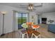Dining area adjacent to kitchen with scenic balcony and comfortable seating arrangement at 19451 Gulf Blvd # 301, Indian Shores, FL 33785