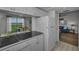 Bright kitchen with views to dining area and living room with lots of storage at 19451 Gulf Blvd # 301, Indian Shores, FL 33785