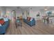 Spacious living room showing the open floor plan to dining area and second living space at 19451 Gulf Blvd # 301, Indian Shores, FL 33785