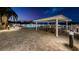 Community pool area with poolside bar under a covered pavilion for shade at 19451 Gulf Blvd # 301, Indian Shores, FL 33785