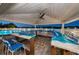 Outdoor pool bar with unique countertop design and plenty of seating at 19451 Gulf Blvd # 301, Indian Shores, FL 33785
