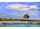 Community swimming pool with a rainbow in the background at 19451 Gulf Blvd # 301, Indian Shores, FL 33785