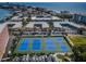 The well-maintained tennis courts offer a recreational amenity surrounded by green spaces and residential buildings at 19451 Gulf Blvd # 301, Indian Shores, FL 33785