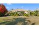 Scenic backyard showcasing lush landscaping, mature trees, and privacy at 2325 W Del Webb Blvd, Sun City Center, FL 33573