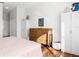 Bedroom showcasing hardwood floors, a classic dresser, and built-in wardrobes providing lots of storage at 2325 W Del Webb Blvd, Sun City Center, FL 33573