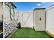 Well-maintained backyard featuring artificial turf, a shed, and a gated entrance at 24862 Us Highway 19 N # 1701, Clearwater, FL 33763