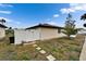 Private backyard with a new white fence and stone path, offering a serene outdoor space at 24862 Us Highway 19 N # 1701, Clearwater, FL 33763