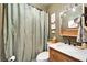 Bathroom offering a wooden vanity and a shower with olive green accents at 24862 Us Highway 19 N # 1701, Clearwater, FL 33763