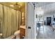 Bathroom offering a wooden vanity and a shower with olive green accents at 24862 Us Highway 19 N # 1701, Clearwater, FL 33763