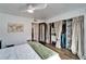 Bedroom featuring large closet spaces with curtain doors and access to other rooms at 24862 Us Highway 19 N # 1701, Clearwater, FL 33763