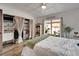 Bedroom featuring a large closet with curtain doors, neutral walls, and natural light at 24862 Us Highway 19 N # 1701, Clearwater, FL 33763