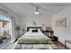 This cozy bedroom features bright, neutral walls, a sliding glass door, and modern decor at 24862 Us Highway 19 N # 1701, Clearwater, FL 33763