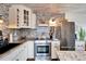 Beautiful kitchen featuring stone accents, stainless steel appliances, and granite countertops at 24862 Us Highway 19 N # 1701, Clearwater, FL 33763