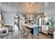 Stylish kitchen with modern island, stainless steel appliances, and stone accent wall at 24862 Us Highway 19 N # 1701, Clearwater, FL 33763