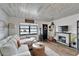 Comfortable living room with stylish furnishings and a cozy fireplace at 24862 Us Highway 19 N # 1701, Clearwater, FL 33763
