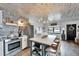 Open-concept kitchen and living space with a breakfast bar and light and airy feel at 24862 Us Highway 19 N # 1701, Clearwater, FL 33763