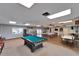 Versatile recreation room featuring a pool table, seating areas, and an open layout for social activities at 24862 Us Highway 19 N # 1701, Clearwater, FL 33763