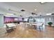 Spacious recreation room offering a pool table, tables, and chairs for community gatherings and entertainment at 24862 Us Highway 19 N # 1701, Clearwater, FL 33763