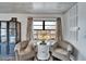 Cozy seating area with plush chairs, decorative shelving, and bright natural light at 24862 Us Highway 19 N # 1701, Clearwater, FL 33763