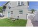 Backyard view, displaying a small patio area with two lawn chairs and the building's exterior at 2835 3Rd N Ave, St Petersburg, FL 33713