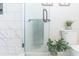 Marble tile shower with glass door in modern bathroom at 2835 3Rd N Ave, St Petersburg, FL 33713