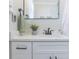 Modern bathroom vanity featuring a marble countertop, white cabinetry, and sleek black hardware at 2835 3Rd N Ave, St Petersburg, FL 33713