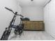 Bedroom featuring an E-Bike parked inside, with an antique wood dresser and bright white doors at 2835 3Rd N Ave, St Petersburg, FL 33713