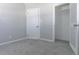 Bedroom featuring fresh paint, new carpet, door to closet, and ample natural light at 2835 3Rd N Ave, St Petersburg, FL 33713