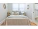 Comfortable bedroom features warm tones, a connection to the bathroom, and sunny windows at 2835 3Rd N Ave, St Petersburg, FL 33713