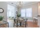 Dining area with wood floors, stylish furnishings, and an open view into the living area at 2835 3Rd N Ave, St Petersburg, FL 33713
